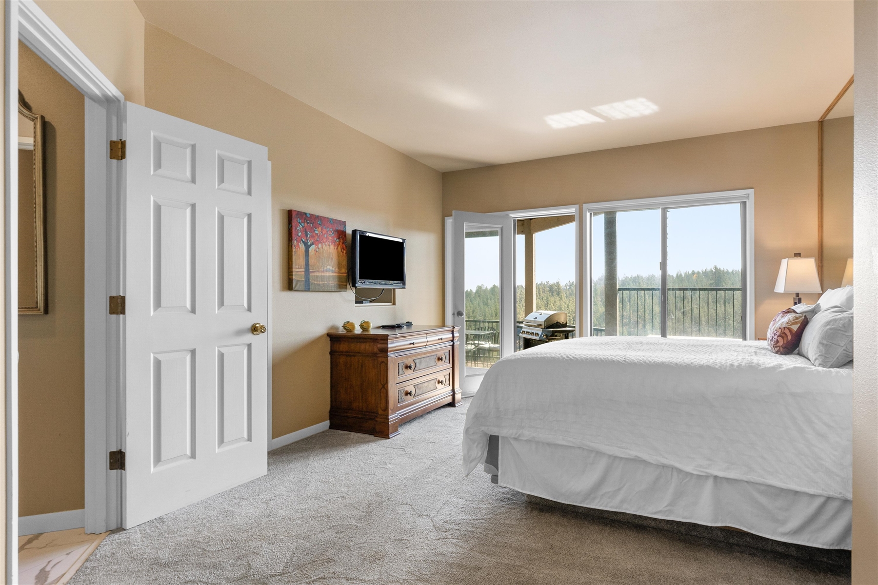 Our King main suite includes an ensuite bathroom and direct access to the new deck and hot tub!