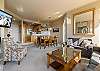 Open concept space – living room, dining area, and kitchen. 