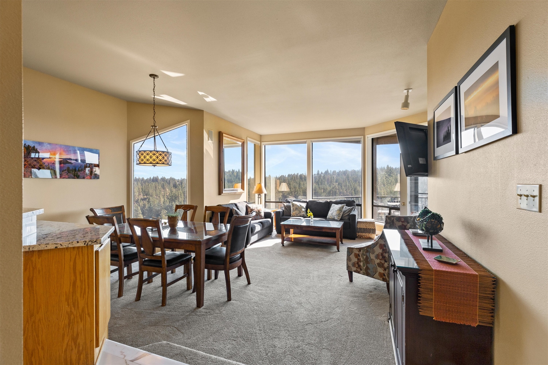 Open concept space – living room, dining area, and kitchen. 