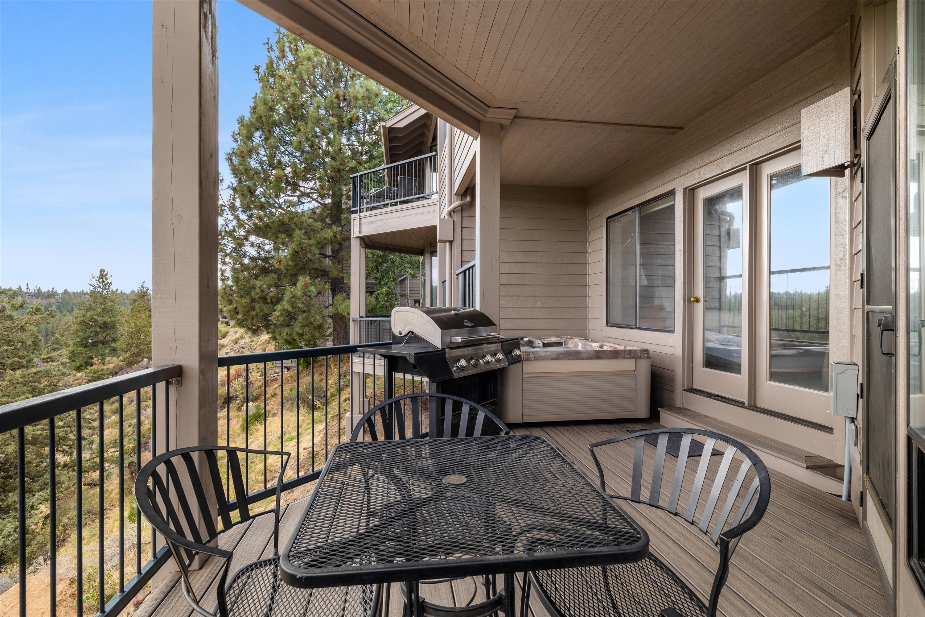New deck and hot tub, plus an outdoor dining and grill area.