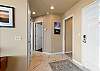 Entryway and hallway inside the condo. 