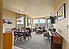 Open concept space – living room, dining area, and kitchen. 