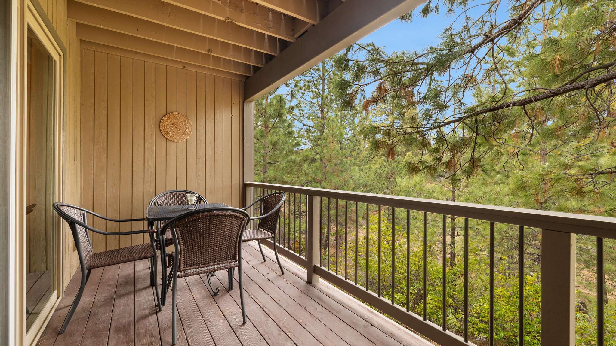 Deck with grill and outdoor dining seating for 4.