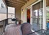 Deck with grill and outdoor dining seating for 4.