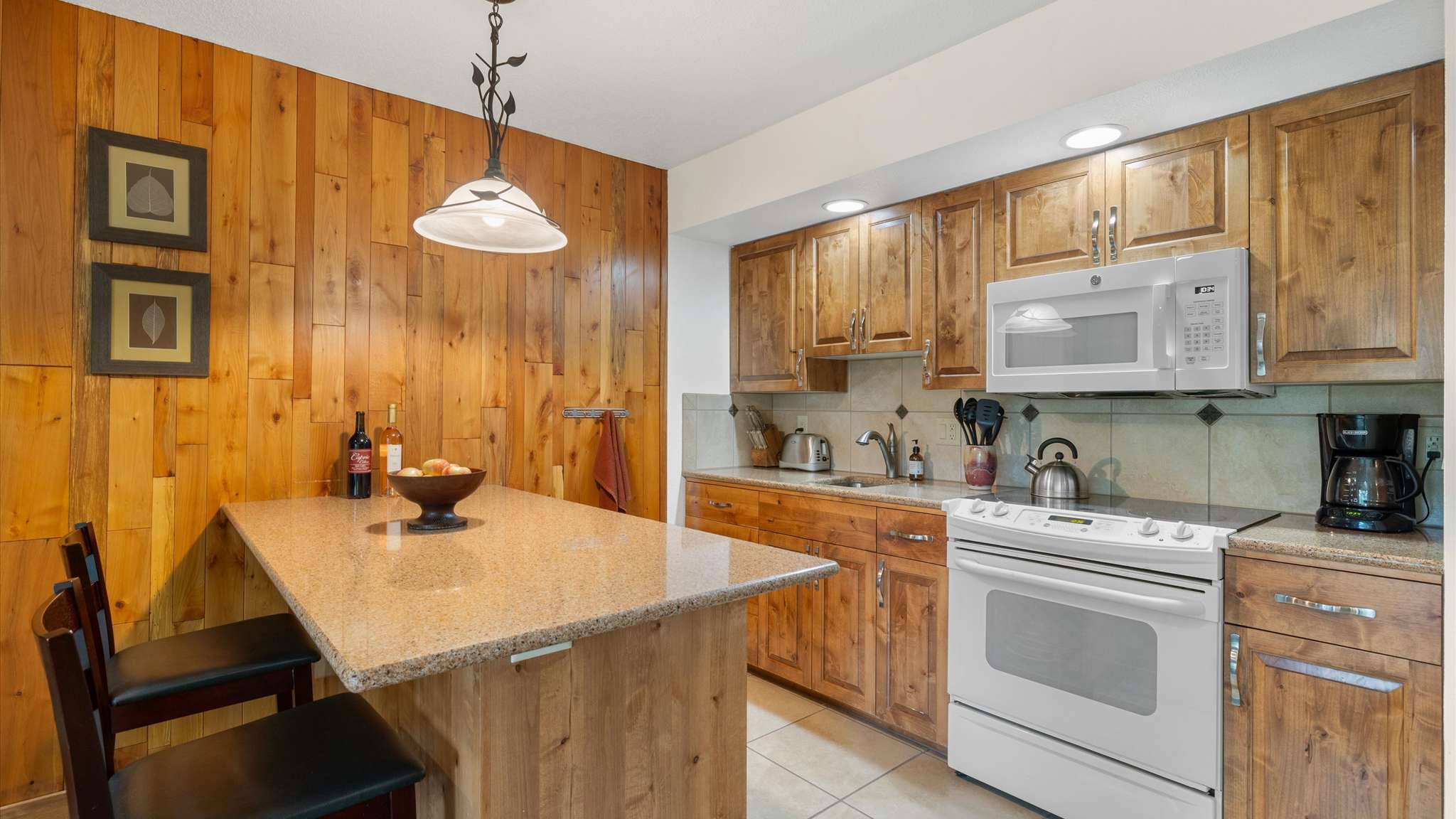 Granite slab countertops in kitchen. 