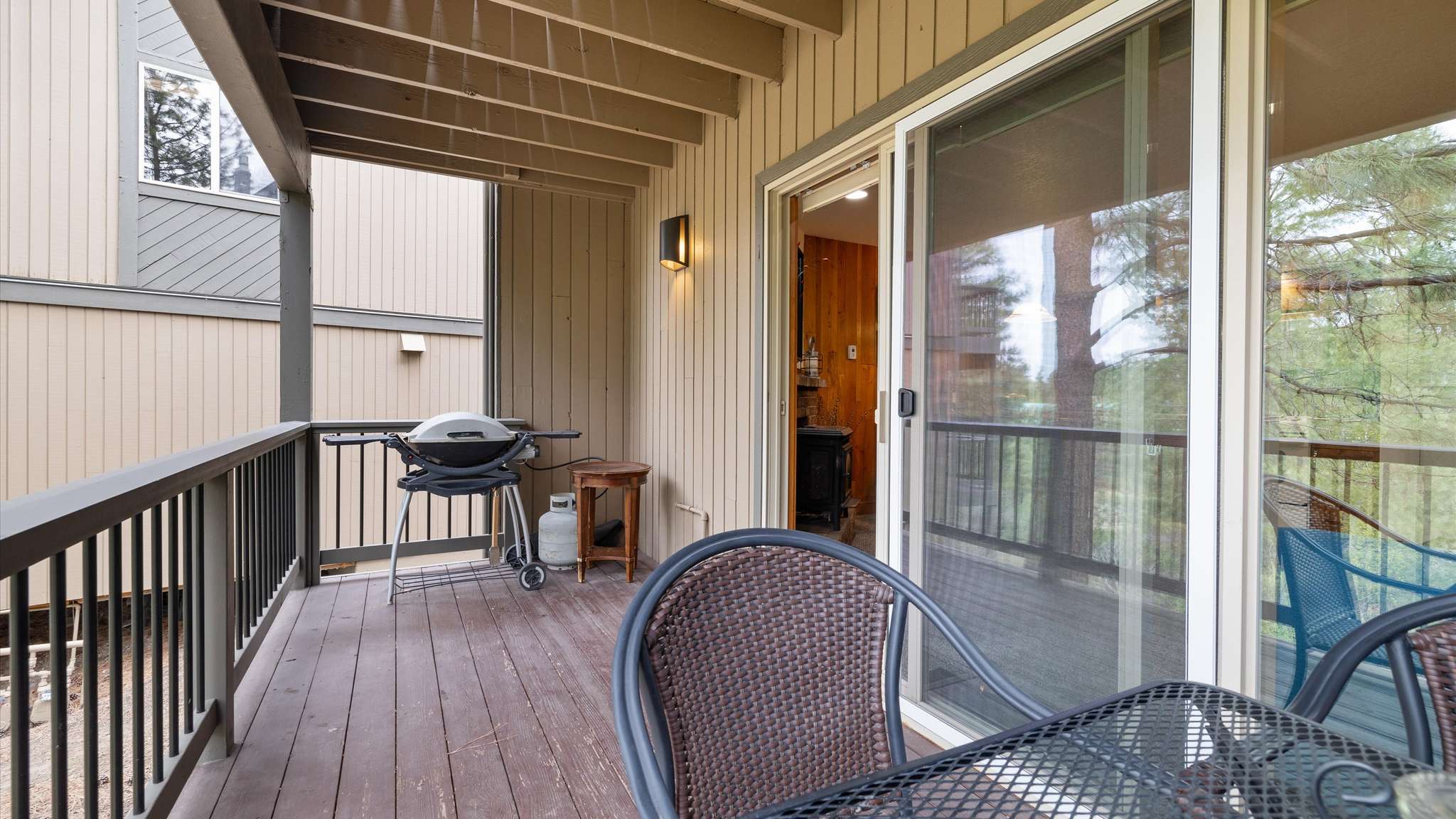 Deck with grill and outdoor dining seating for 4.