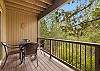 Deck with grill and outdoor dining seating for 4.