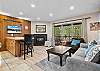 Open living room with gas fireplace, smart TV and comfortable sleeper sofa.