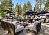 Community fire pit and lounge area near pools and hot tubs. 