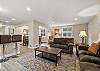 Living room with a smart TV and breakfast bar for three. 