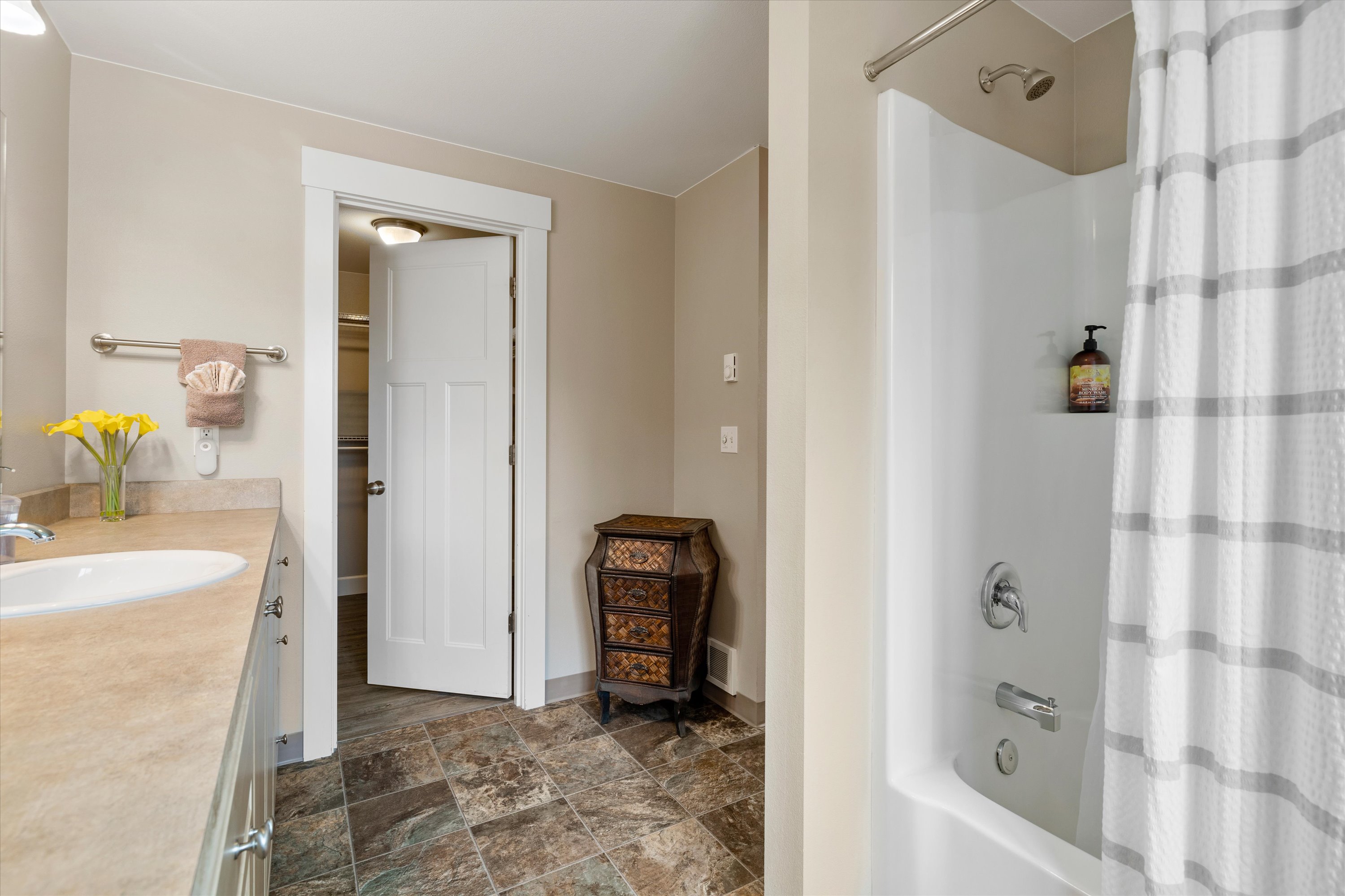 King master suite main bathroom with a combo tub/shower.