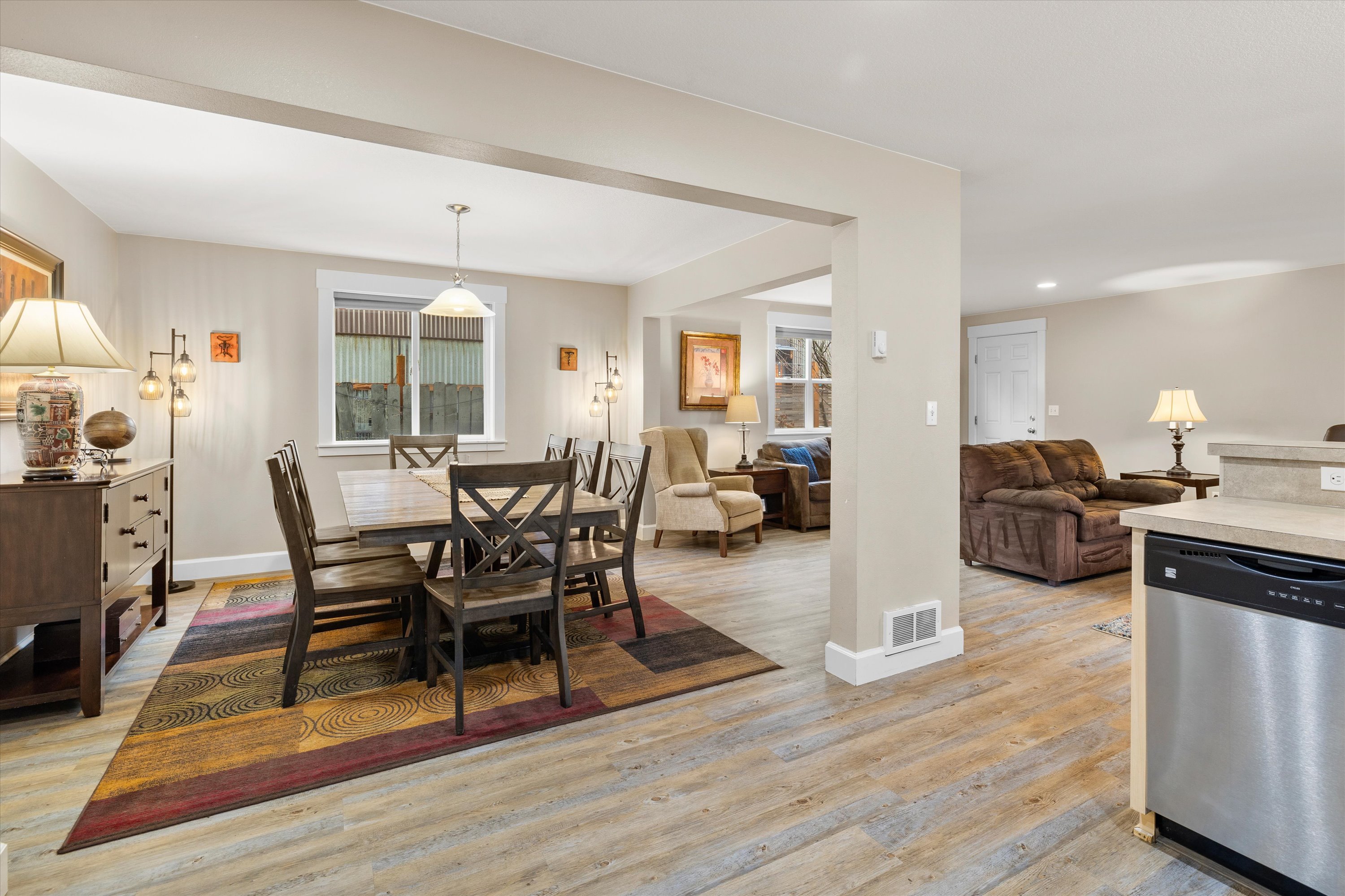 Open concept living room, dining area, and kitchen. Plenty of space and light!
