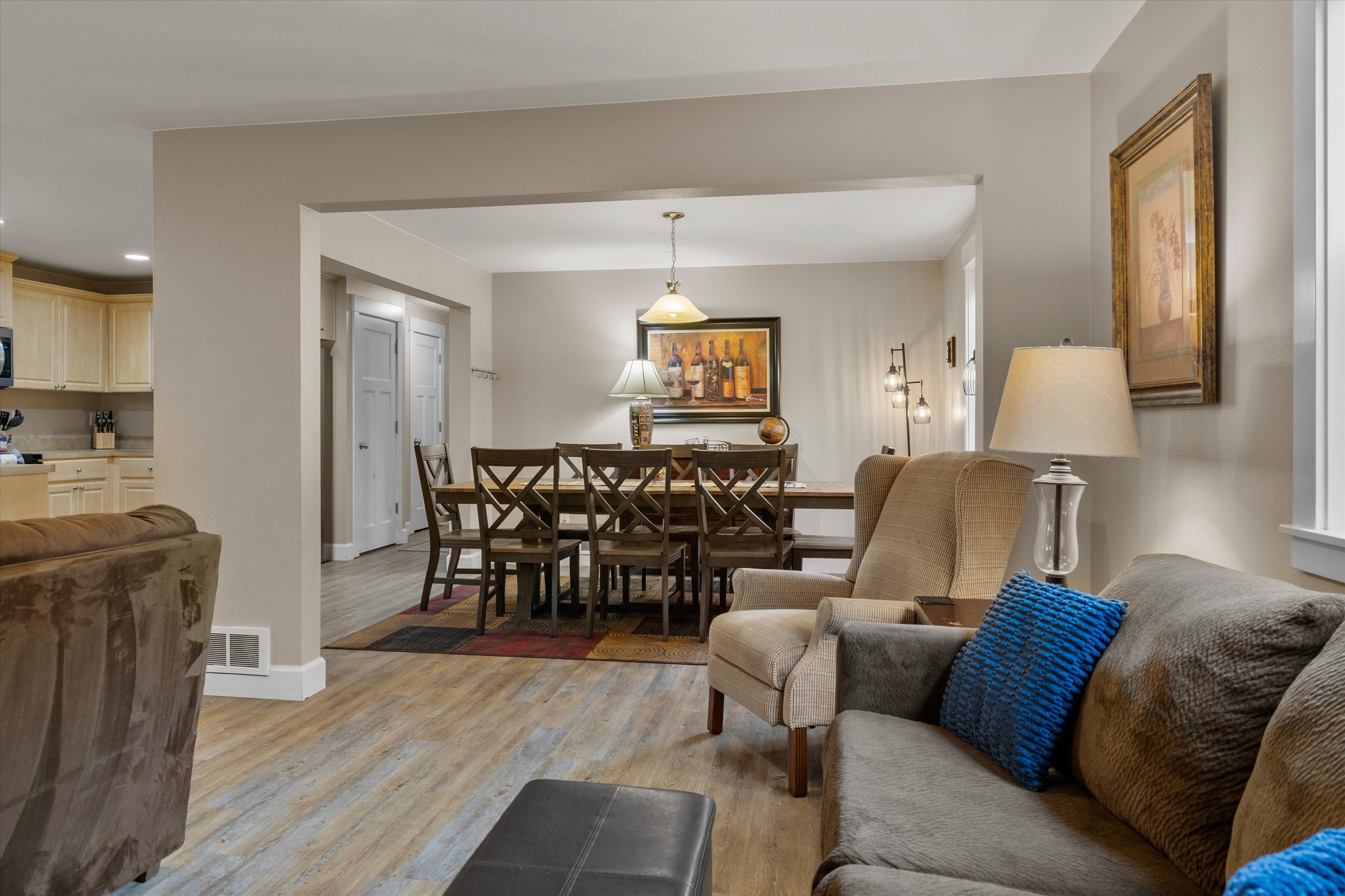 Open concept living room, dining area, and kitchen. Plenty of space and light!