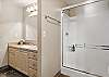 Upstairs guest bathroom with shower/tub combo. 