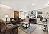 Living room with a smart TV and breakfast bar for three. 