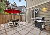Outdoor patio with gas grill and seating for 6. 
