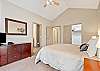 King main suite on lower level with private entrance to hot tub. Includes ensuite bathroom and a closet.