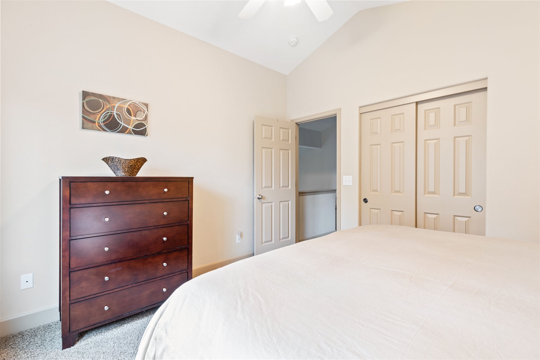King guest room with ceiling fan, upper level.
