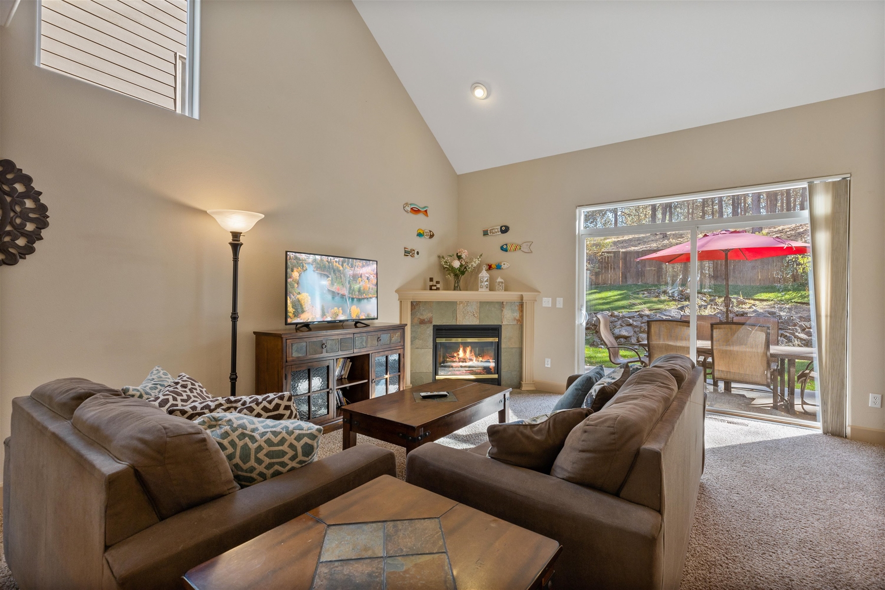 Comfortable living room with queen sofa sleeper. Walk outside to the backyard, patio and hot tub. 