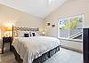 King guest room with ceiling fan, upper level.