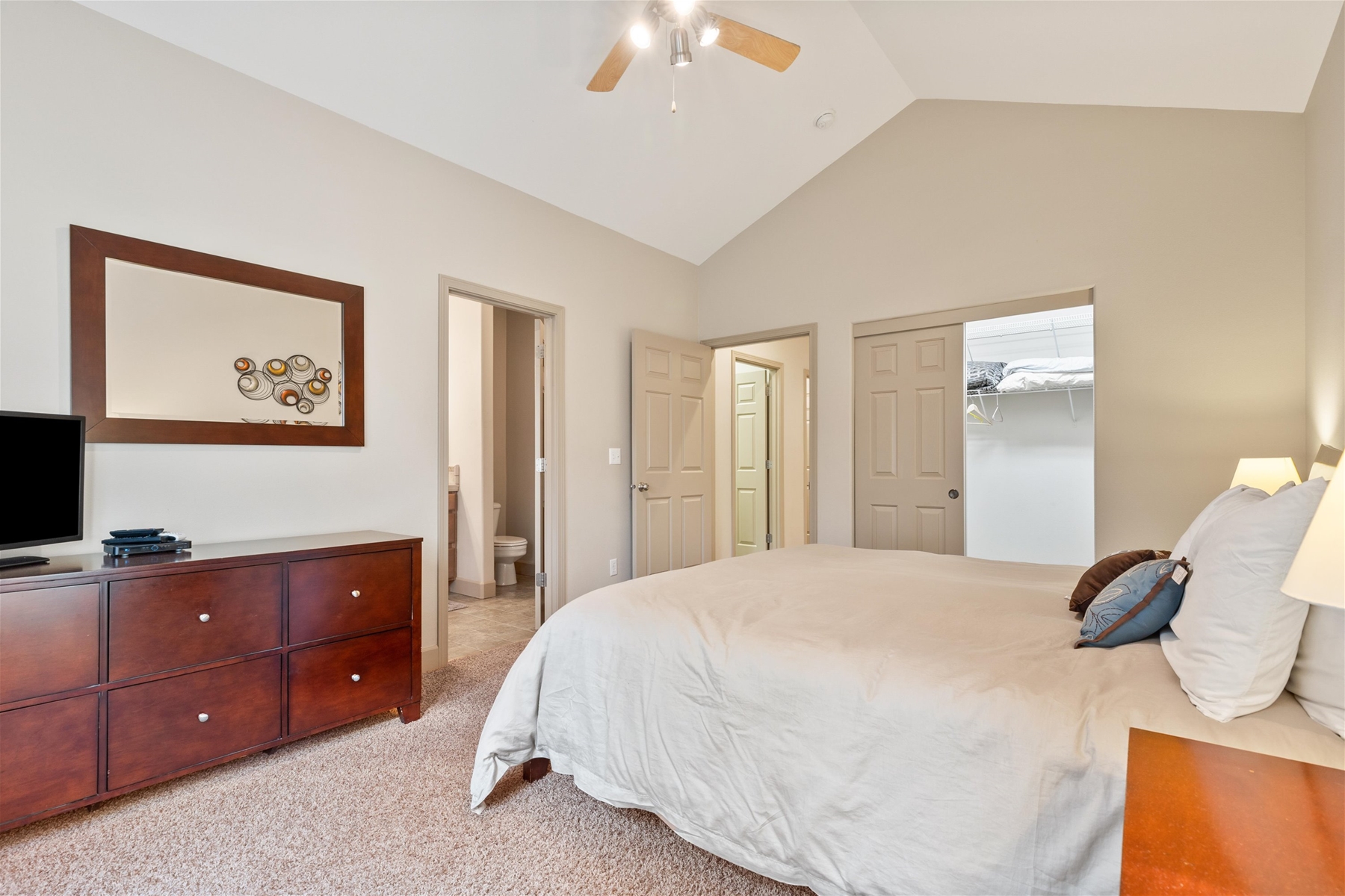 King main suite on lower level with private entrance to hot tub. Includes ensuite bathroom and a closet.