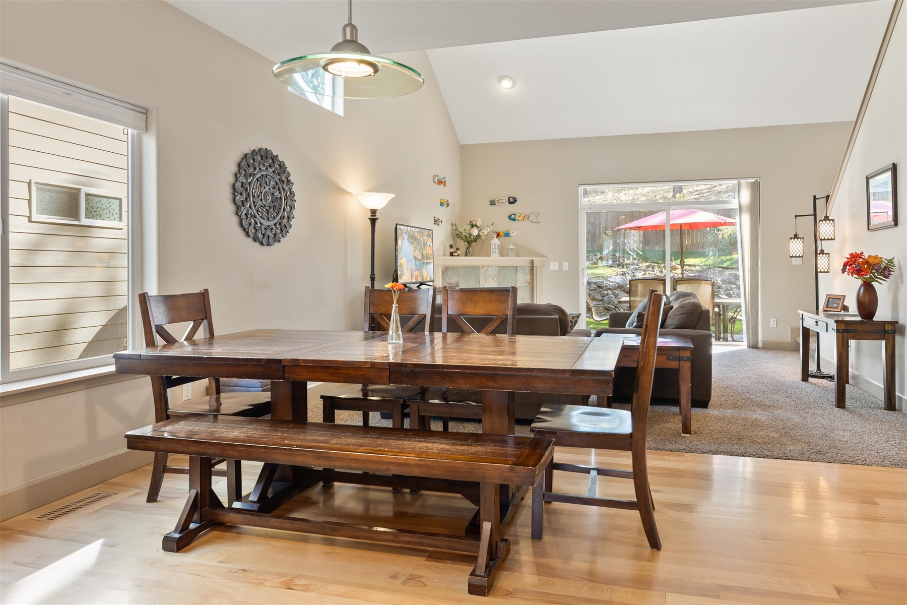 Light and bright throughout – open concept living room, dining area, and kitchen. 