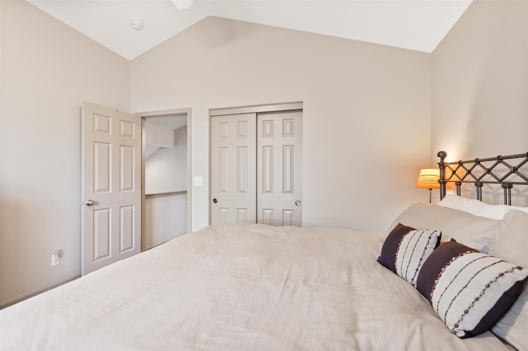 King guest room with ceiling fan, upper level.