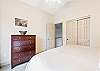 King guest room with ceiling fan, upper level.