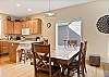 Gather comfortably with dining table space for 6 guests and bar seating for 2. 