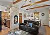 Cozy living room with two sofas (one is a sleeper sofa) and gas fireplace. 