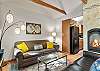 Cozy living room with two sofas, smart TV and gas fireplace. 