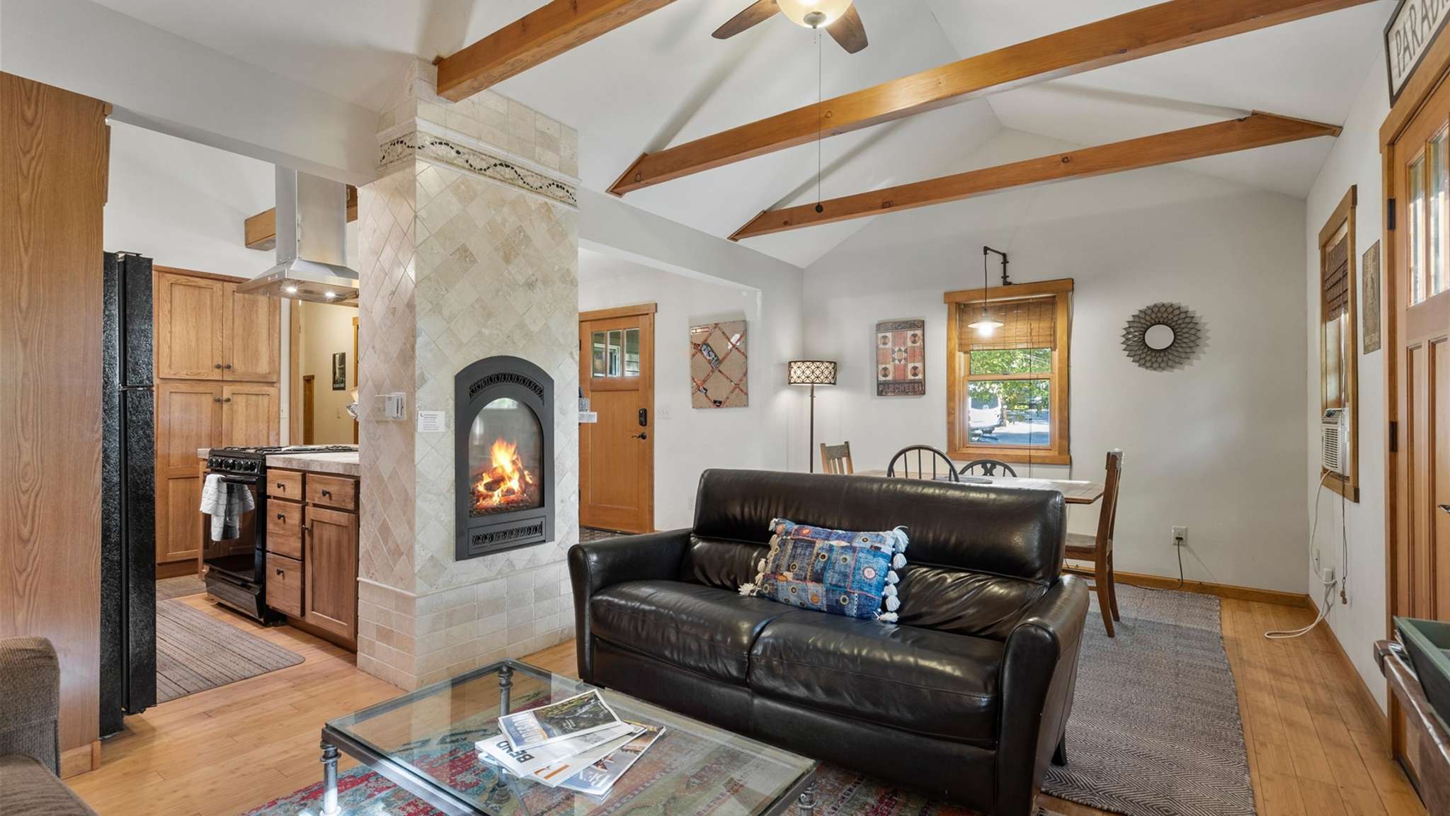Cozy living room with two sofas (one is a sleeper sofa) and gas fireplace. 