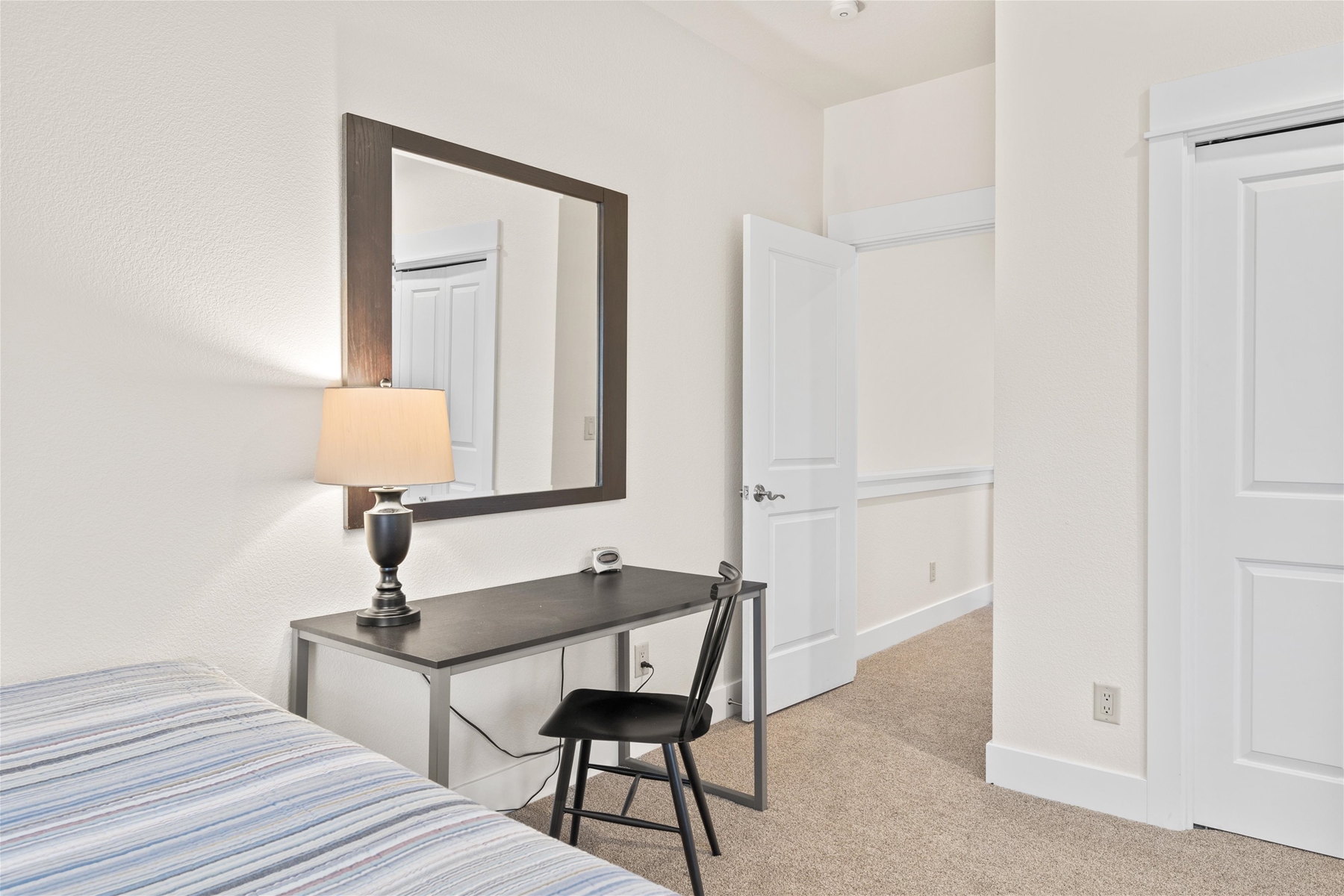 Queen guest room with two queen beds and a work space, upper level. 