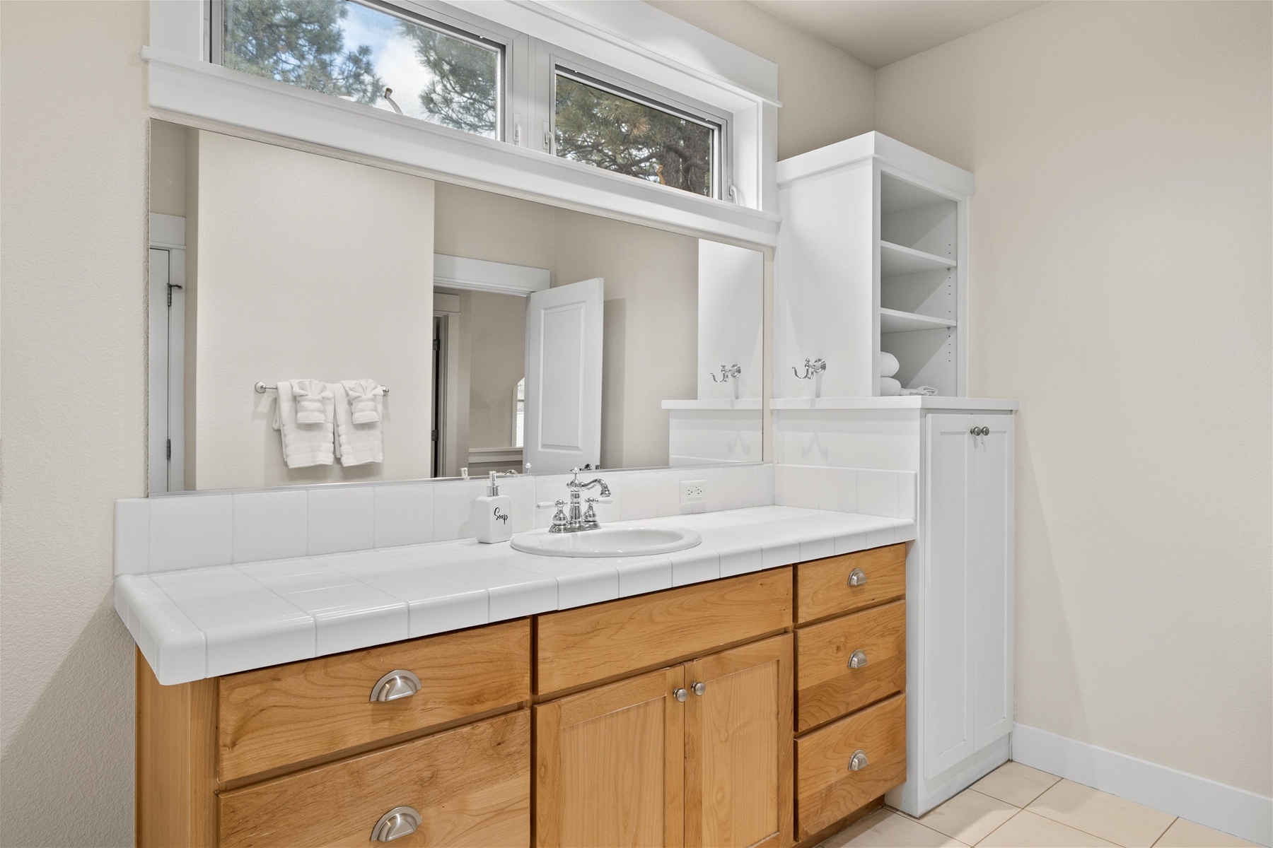 Spacious guest bathroom with tub and shower combo for added flexibility.