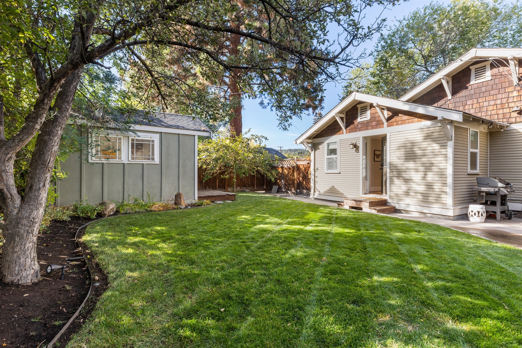 Beautifully landscaped backyard – includes a storage shed with locks for bikes, snowboards, and skis.