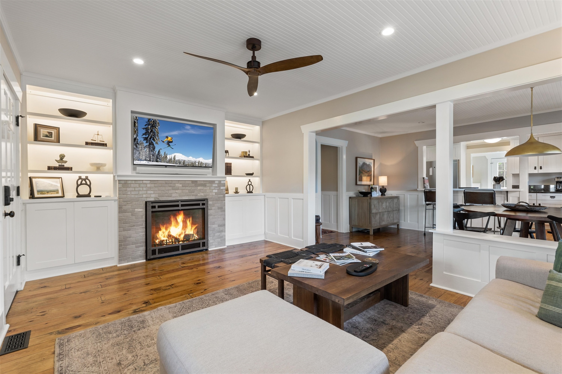 Living room with a fireplace and 55