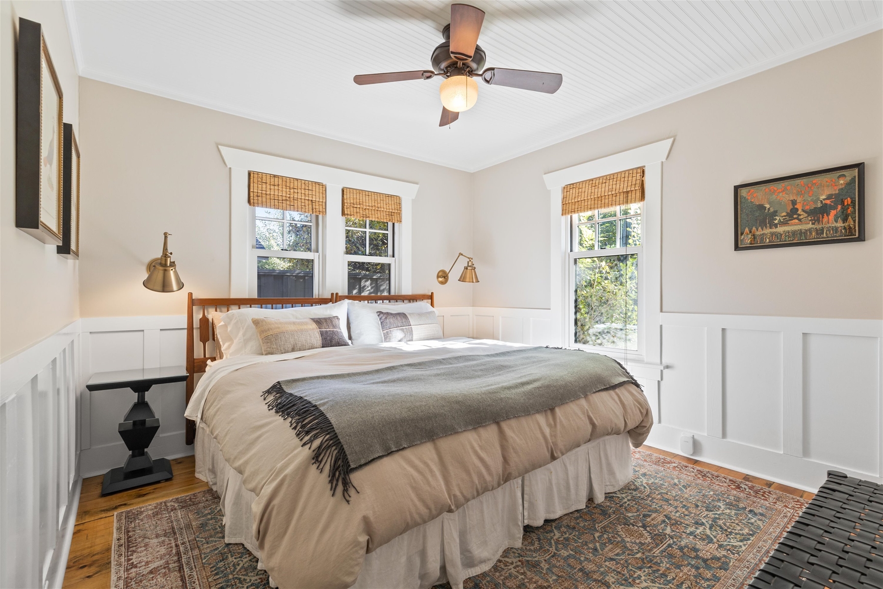 King guest suite with ceiling fan and dresser in closet. 