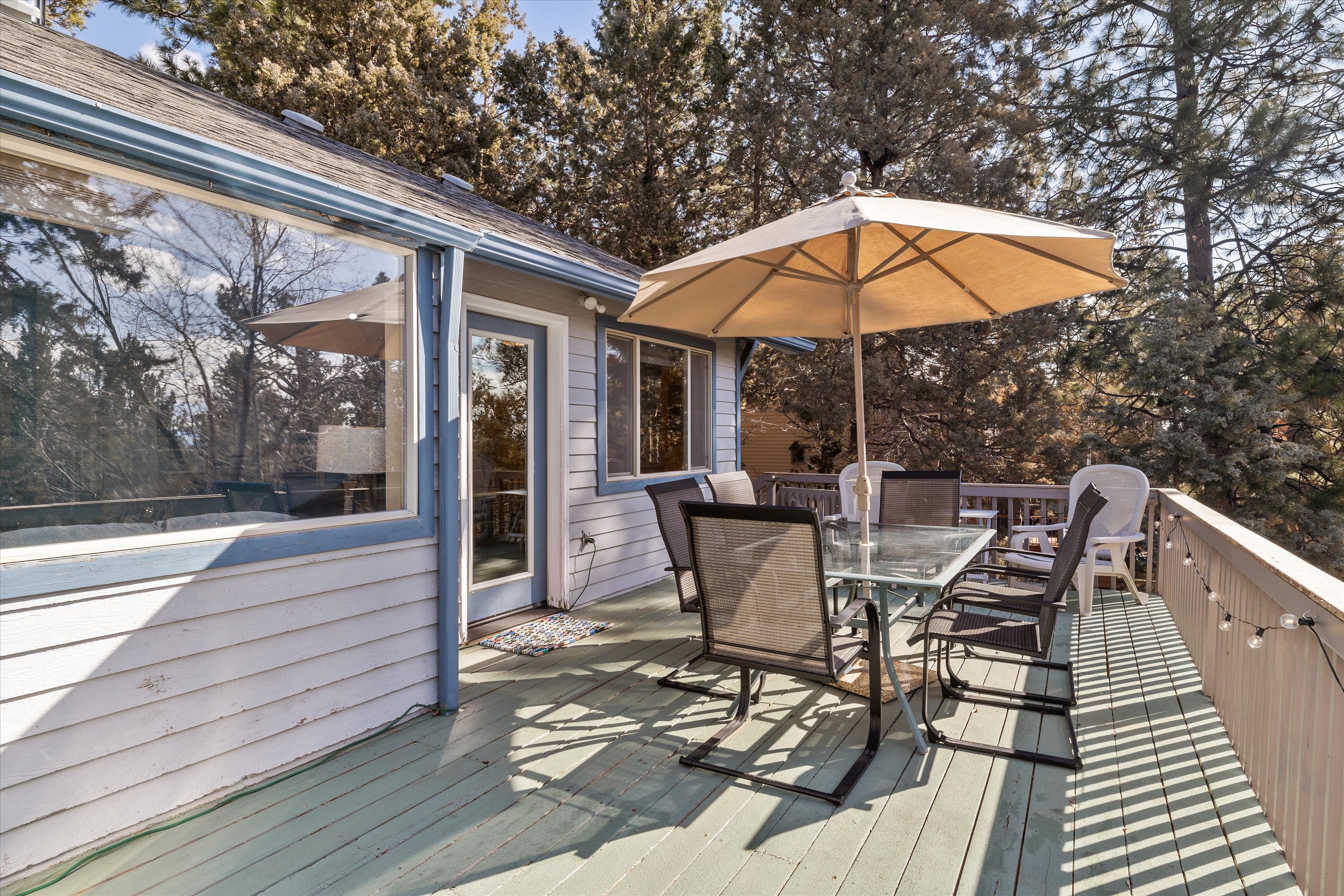Upper deck accessed from living room. Outdoor dining, BBQ grill, and beautiful views. 