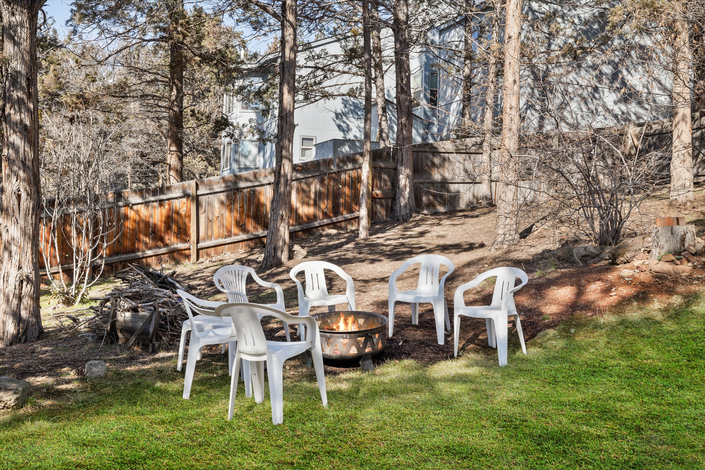 Enjoy the evening nights around the fire pit in the fenced-in backyard. 