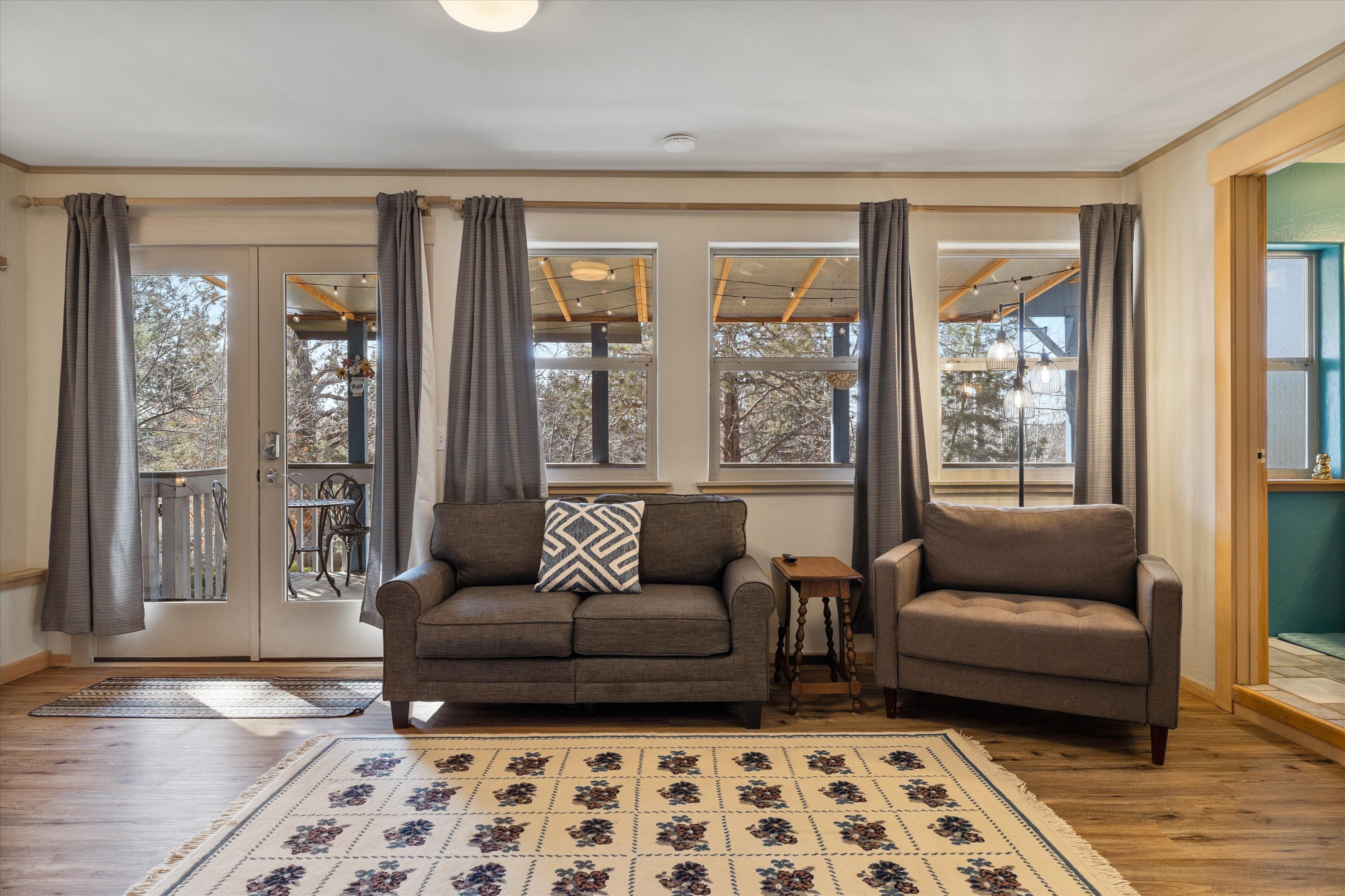 Private studio with queen bed, kitchenette, smart TV, and full bathroom – Lower level.