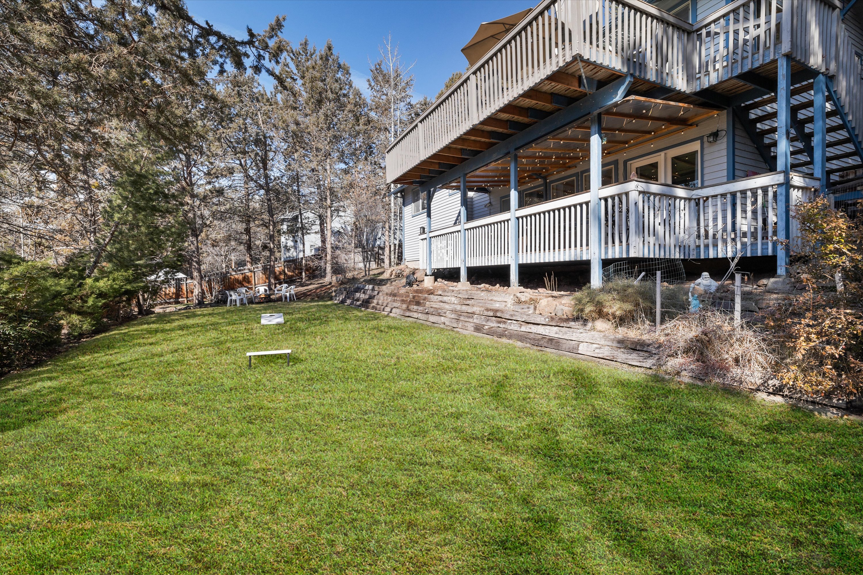 Mature landscaping, corn hole and croquet. 