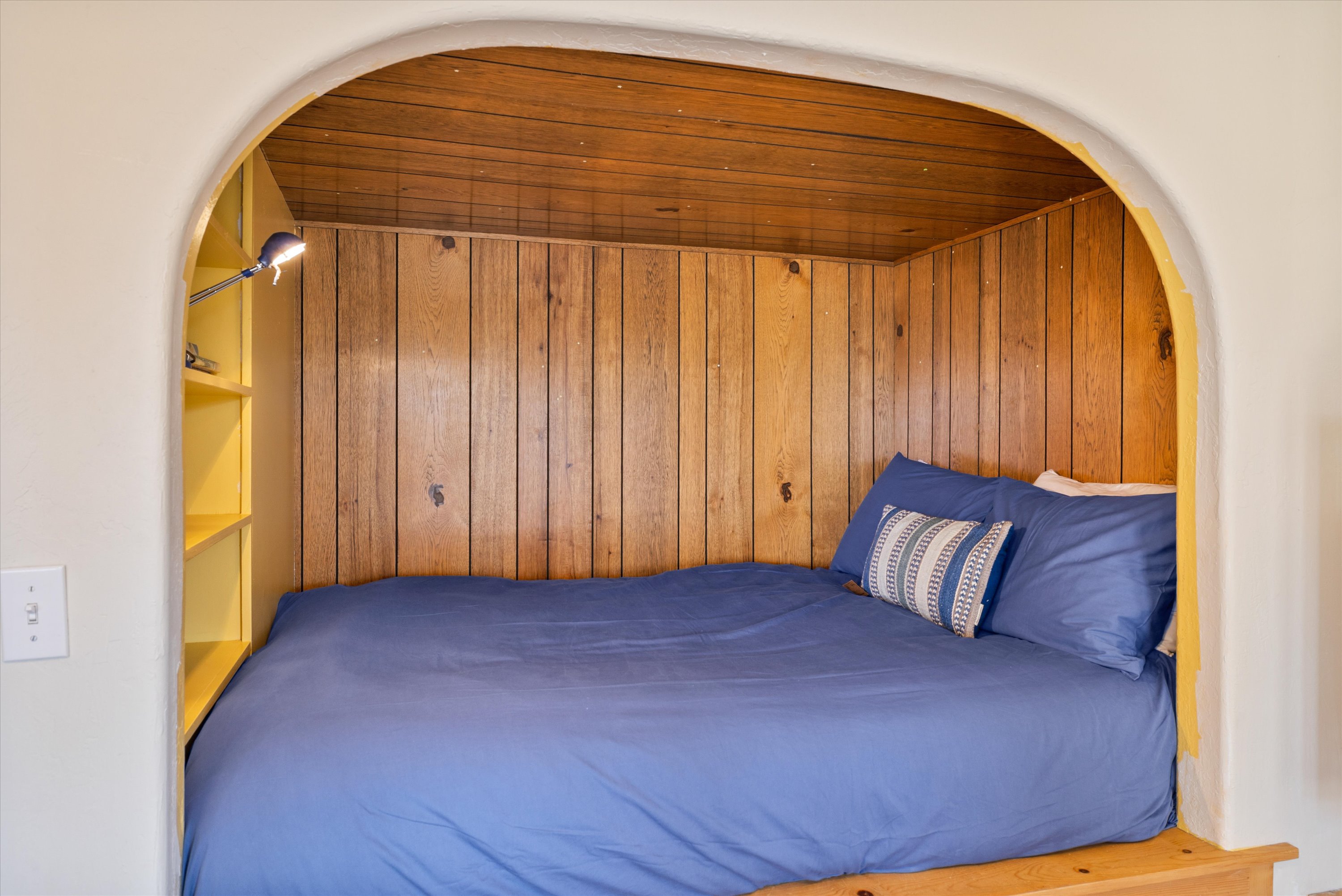 Queen bed inside the private studio – lower level. 