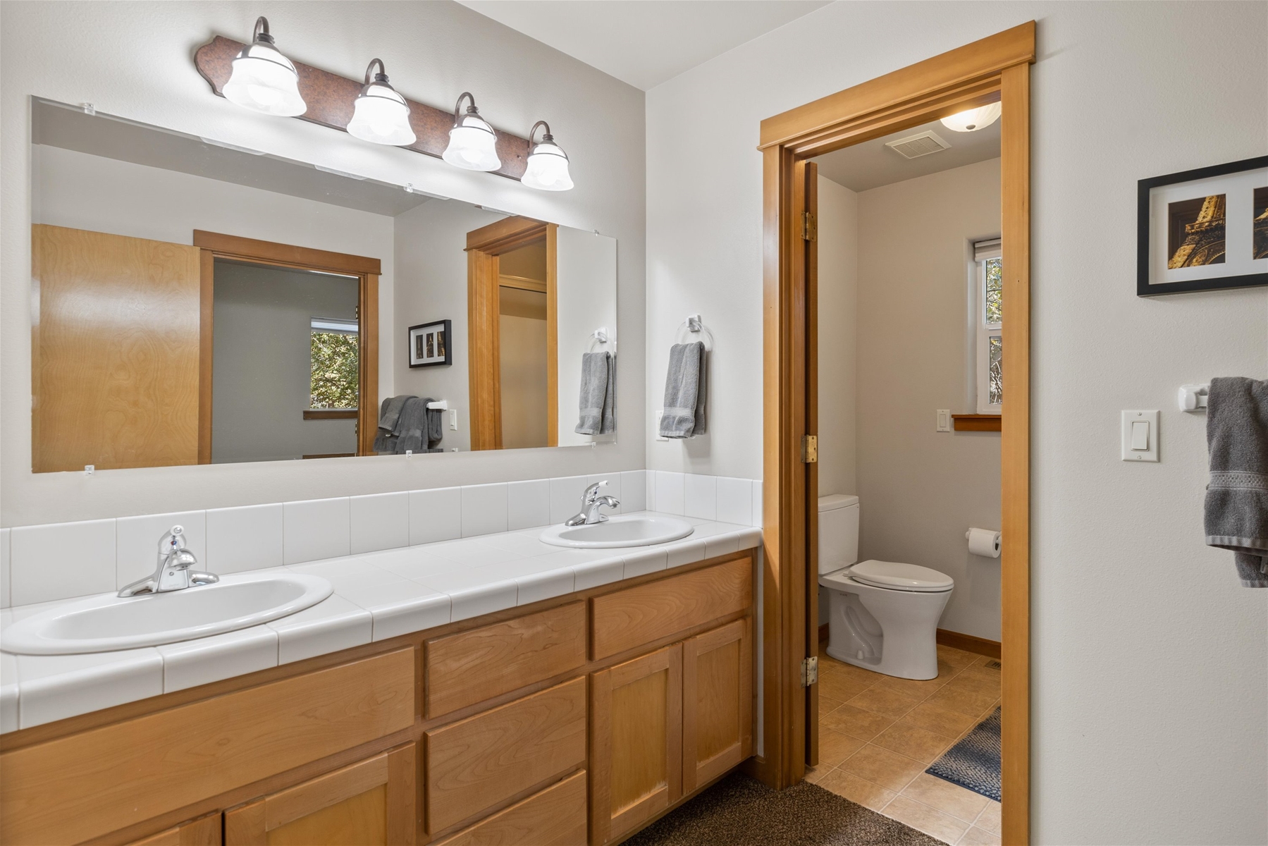 King private on suite bath with dual sinks and shower – upper level. 