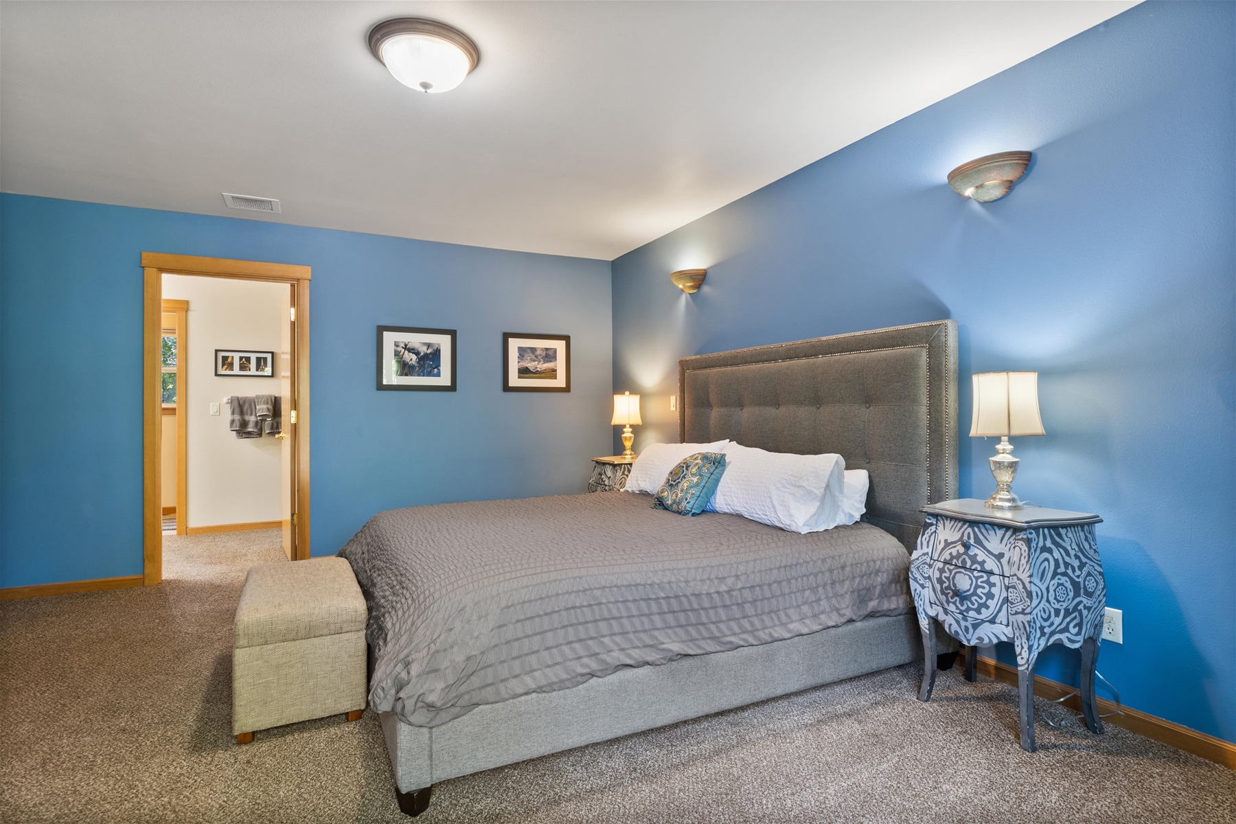 Unwind in this spacious king main suite with a Smart TV and private balcony – Upper level. 