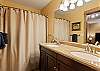 Guest bathroom with tub and shower combo for added flexibility.
