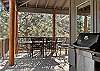 Gas grill and outdoor dining seating for 6 on the deck. 