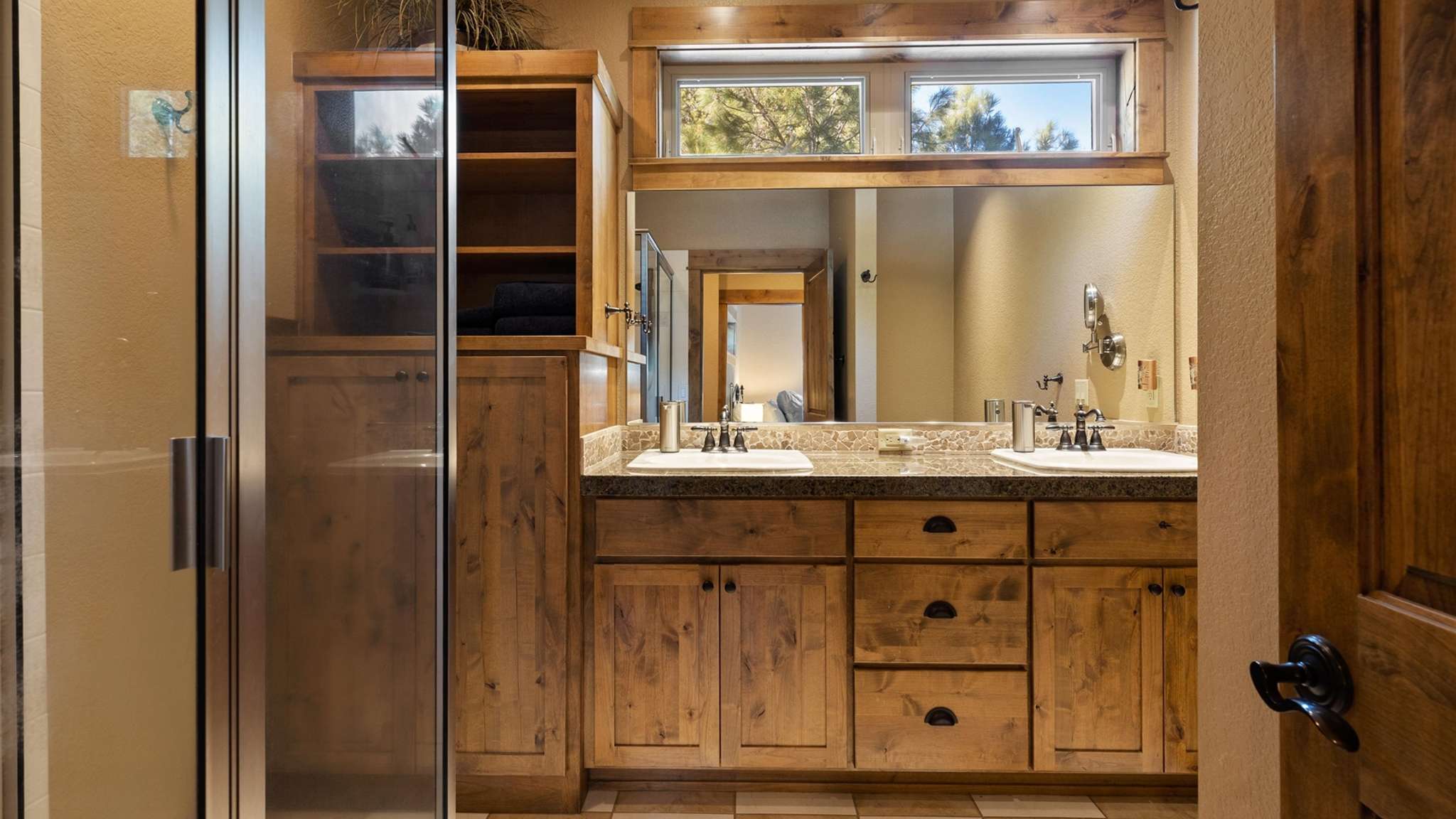 King bed, walk-in closet, ensuite bathroom with dual sinks and shower