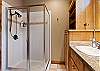 King bed, walk-in closet, ensuite bathroom with dual sinks and shower