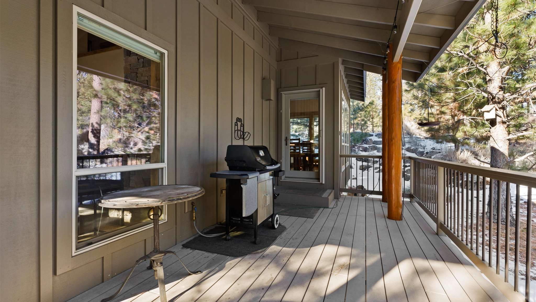 Gas grill and outdoor dining seating for 6 on the deck. 