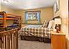 Queen bed and two sets of twin bunks